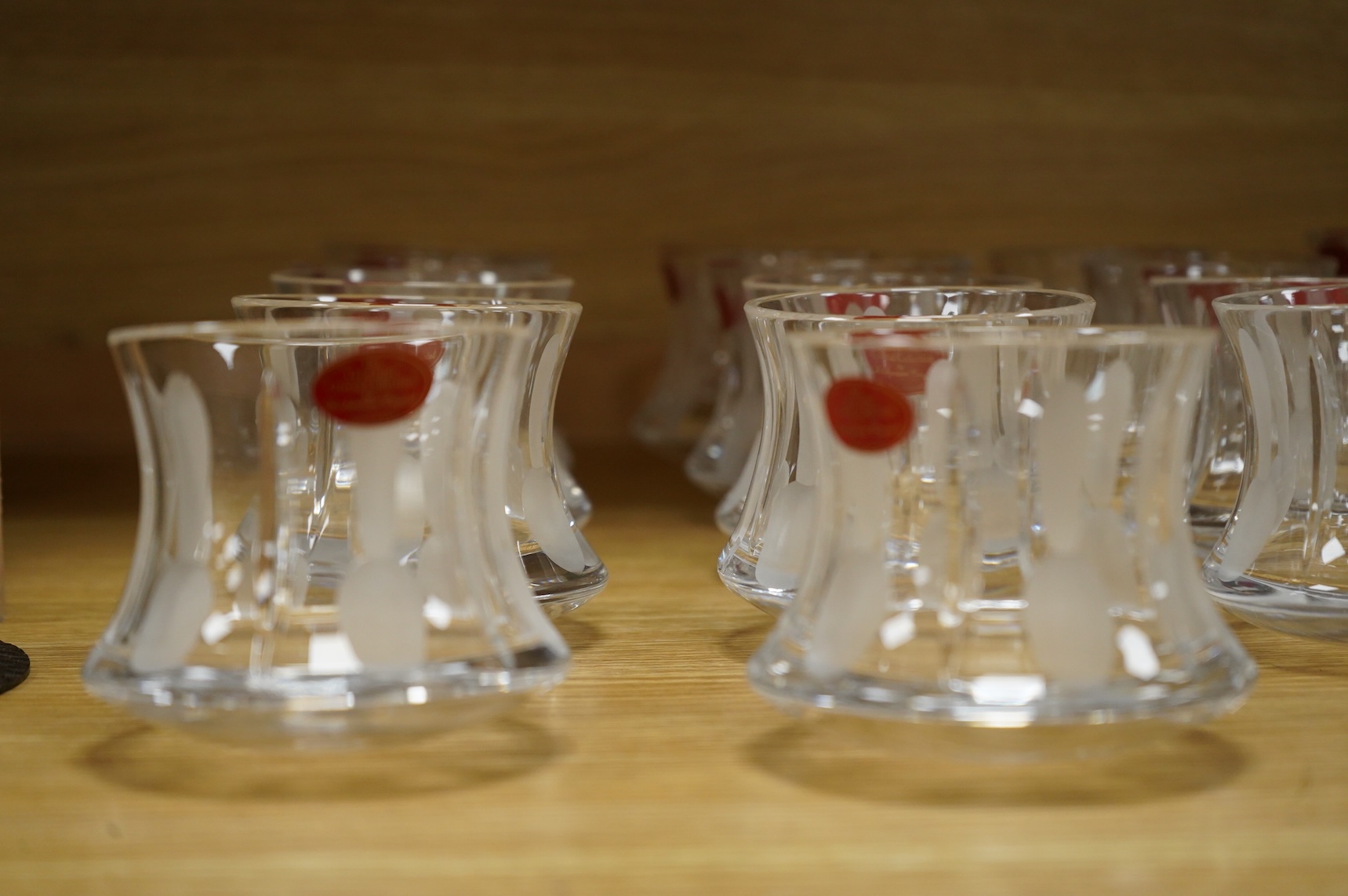 A collection of twenty five Uri Geller Crystal Collection whisky tumblers by Dickenson Crystal, 9cm high